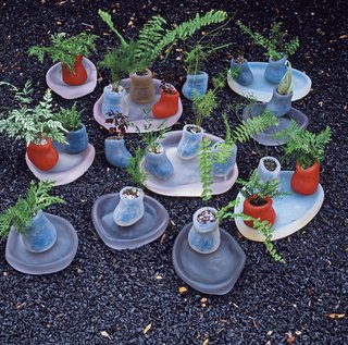 Terra Ephemera - Photo 2 of 6 - An assortment of mini silicone planters and polyurethane trays highlight a delicate assemblage of ferns and oxalis plants. Both the planters and the trays are produced in series by Salon 94, one of her two galleries.