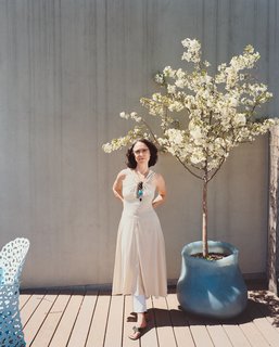 Terra Ephemera - Photo 4 of 6 - Paula Hayes poses next to one of her creations.