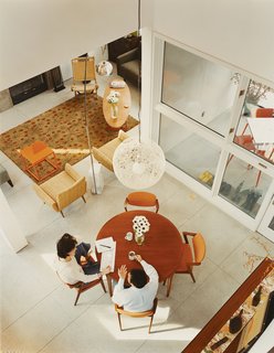 Gaffney House Dining Room - Photo 3 of 10 - Instead of buying new furniture, Backus went in favor of re-use and outfitted the house almost entirely with eBay finds, with the exception of the Flos Arco floor lamp by Castiglioni and the Random light by Moooi. "I spent months online looking for the right pieces," he says. "It was fun sourcing the furniture myself."