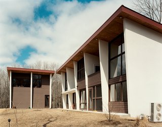 Gaffney House Dining Room - Photo 10 of 10 - Protruding SIP fins on the exterior collude with an overhang to minimize the sun's rays in summer, an important consideration when thinking about heating and cooling the tall, open living areas.