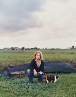 Claudy Jongstra kneels with a family cat in the yard behind her office and home, which she shares with her partner, Claudia Busson, and their two sons, Eabal and Jesk. Behind her is a small dinghy that the family uses to navigate the numerous irrigation canals that traverse the farmlands throughout Friesland. Despite its modest scale, Jongstra’s studio has worked on major collaborations with Hella Jongerius,Tord Boontje, Steven Holl, andRem Koolhaas, in addition tofashion design for Alexander van Slobbe and costume work for Star Wars: The Phantom Menace.