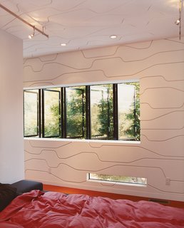A plywood wall, created by architect Thom Faulders and Andre Caradec of Studio Under Manufacture, an Oakland design and fabrication firm that specializes in digital millwork.