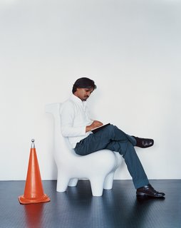The designer is pictured here on a prototype of his Horse chair, a design that has become iconic for him. Eminently suited for a wide variety of settings, the seat has been executed in materials using bell metal and Corian.