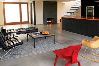Building Green in Santa Monica - Photo 5 of 5 - The sides of the orange Corian kitchen counter are clad in recycled rubber.
