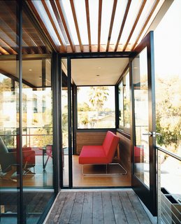 On the second floor, an open balcony of FSC-certified tigerwood with a cedar trellis leads into a light-filled study/guest bedroom.