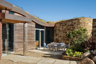 Big Sur: Going Coastal - Photo 3 of 6 - The structure sits lightly on a stone patio that cuts into the hillside site.