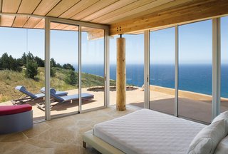 Big Sur: Going Coastal - Photo 4 of 6 - Two walls of floor-to-ceiling windows in the master bedroom frame expansive vistas of the Pacific Ocean.
