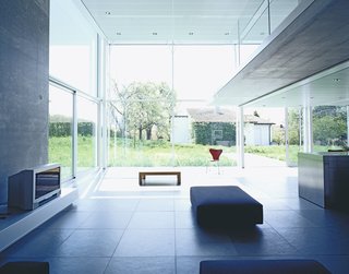 A view toward the garden from the living room (right) gives perspective to the double-height space.