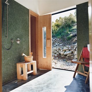 Nature Nurtured - Photo 5 of 11 - Queenstown gets cold in winter, hence the installation of a sauna. Outside, the landscaping was kept deliberately casual, with rock walls and gravel paths.