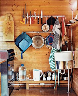 Magnets and hooks keep kitchen necessities within reach.
