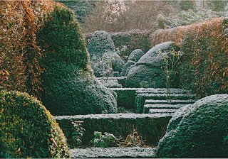 The landscaped garden outside of a home in Karlsruhe, Germany, designed by Klahn + Singer + Partner, employs a sculptural take on the traditional cabinet or hedgerow.