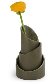 These cylindrical nesting vases are inspired by the shape of bamboo. Though made from ceramic, the surfaces have a roughness that evokes forests or jungles. They come as a set of three and can be stacked and used as a single vase, or separated and arranged as a trio. Made by hand in Brazil. 5 ½" h x 3 1/3" diam. $80.00