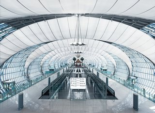 Suvarnabhumi International Airport, Bangkok, Thailand. From the main building the gates are reached via concourses, consisting of a system of flattened tubes.