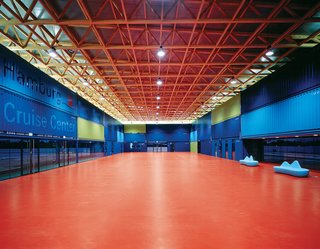 The interior of the Hamburg Cruise Center. As it is temporary, Sobek designed the roof with recycling in mind—the trusses are constructed using wooden beams.