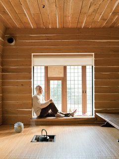 10 Warm Wood Floors - Photo 6 of 10 - The Tanpopo House's family tearoom is an updated take on Japan’s traditional flexible, open-plan tatami-mat room. Here, the charcoal fire pit for the teapot is an electric coil embedded in the floor, and the flooring is a durable rattan from Indonesia. Plaster oozing in-between oak planks gives the room a warm, rough-hewn feel—a Fujimori signature.
