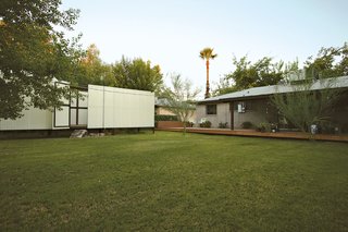 Portable and easy to move should the couple relocate, the pods rest lightly on the lawn behind the main house.