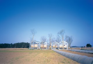 Sitting placidly in the midst of open farmland (as evidenced by the gray plastic crop covers that seem to run into the greenhouses), Millennium City is an experiment by Japanese architect Hiroshi Iguchi in utopian sustainable living.