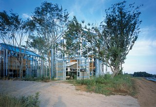 Architect Hiroshi Iguchi’s sustainable solution was to surround the greenhouses with tall, deciduous trees. In the summer, the "breathing" of the trees’ leaves and the shadows they cast over the homes help cool the spaces. To combat moisture from the humidity, residents can open the top windows of the glass spaces.