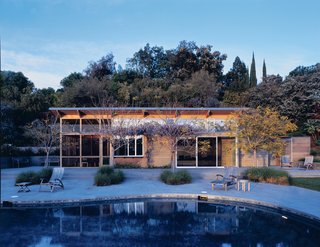 A study in contrasts with the stolid stucco main house, this 750-square-foot pool house seems to float lackadaisically on the bluestone terrace. "The pool house speaks of summer," says designer E. B. Min.<br><br>Project: Burt Pool House<br><br>Architect: Min/Day<br><br>Location: Palo Alto, California
