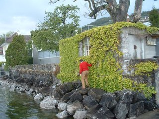 Climbing across the rocks to sneak onto the grounds of Le Corbusier's Villa Le Lac in Corseax, Switzerland. Photo by Illya Azaroff.