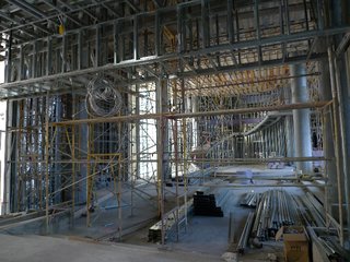 The hotel lobby as entered through the motor court, with a circular staircase at far end.