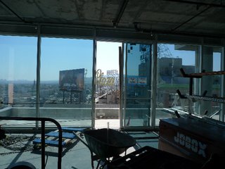 The view west, from a 14th-floor unit with a balcony, looking across Vine.