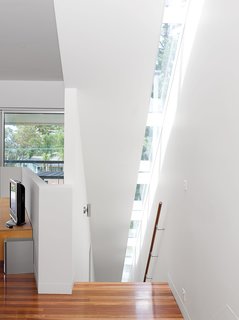 Pedigree Charted - Photo 4 of 10 - Thin skylights running atop the full length of the staircase illuminate the trip up the side of the house.