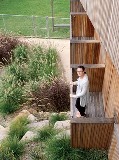 Pedigree Charted - Photo 5 of 10 - Joanna Ferguson stands on one of the balconies extending from the guest bedrooms.