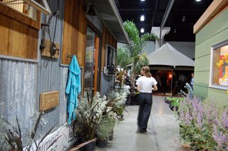 Exhibition Snapshot: Dwell Outdoor - Photo 2 of 4 - At left, an outdoor shower is installed outside Reclaimed Space's 400-square-foot structure. Modern Shed is at right.