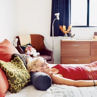 Charvat relaxes in the bedroom.