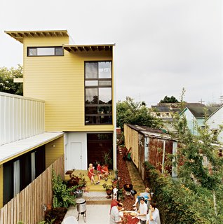 Familiar building elements applied in unexpected ways and a strict rectilinear palette help unify the two building forms. The scale is just right for creating cozy outdoor rooms.