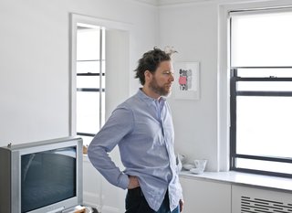 Pulver and Mike worked together to devise a combination radiator cover and storage system that runs below the windows, from room to room, throughout the apartment. The screen has a slotted pattern, which Mike and Pulver painstakingly drafted—"We looked at 30 different variations," Pulver recalls—and Pulver CNC milled into wood panels.