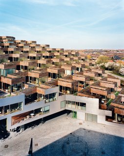 Every apartment has a terrace measuring around 1,000 square feet, with both private and semipublic spaces. "The cool thing about a garden is it’s yours," says architect Bjarke Ingels. "If you’re on the wooden part, you can suntan in your bikini bottom or go without pants." If, however, you walk out onto the artificial turf, you can see what’s going on with your neighbors (and they can see you).