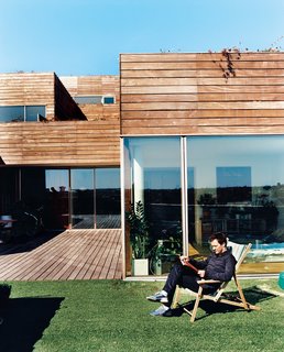 Airy, open, light-filled apartments with walls of glass look out onto 970-square-foot terraces edged in artificial turf. Unlike the too-public, near-exhibitionist qualities of the experimental VM housing next door, Mountain Dwellings all have private terraces and suburbanesque garden spaces.