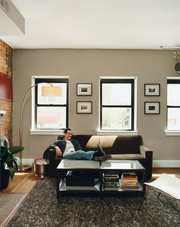 Hoagies' Heroes - Photo 3 of 13 - With a perilously limited budget, Mazza and Patten set about making the second and third floors of their new purchase into a pair of 850-square-foot, three-room bachelor pads. Patten's living room on the second floor gets all its light from windows facing south onto H Street NE.