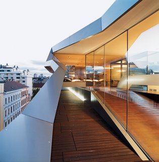 The Penthouse Has Landed - Photo 10 of 16 - A narrow terrace—one of three—hangs precariously over the street.