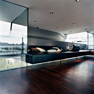 The Penthouse Has Landed - Photo 16 of 16 - Meissl and Delugan’s favorite part of the house is definitely the "relaxation zone," which features a black leather platform of their own design that appears to float between layers of tempered glass. The pillows are by Herman Miller.
