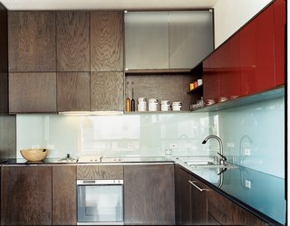 Making Sense of the City - Photo 5 of 11 - MS-31 designed and built all the kitchen cabinetry, as well as the dining table, in collaboration with Archkinetics. The frosted-glass backsplash offers easy cleaning.