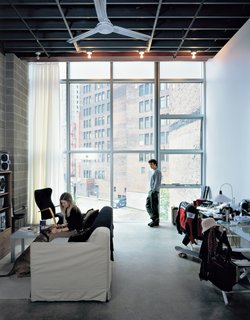 For rents ranging from $900 to $1,500 per month, residents of 947 Liberty, such as Alena Roberts and Jon Norton, get a clean, minimalist space, bracketed by white drywall on one side and unadorned gray cinderblock on the other.