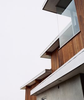 Galvanized-aluminum flashing is used to hide lighting fixtures and to delineate the tops of the redwood-strip walls. "It’s a simple palette of materials," says architect Jesse Bornstein.