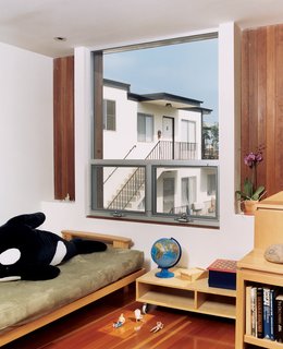 The girls’ room features wood furniture designed by Bornstein.