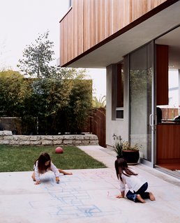 Kalia and Olivia enjoying the outdoor space. Kalia’s favorite part of the house? In her own words, "I like the backyard where we play soccer, hopscotch, and jump rope and draw and have picnics." ’Nuff said.