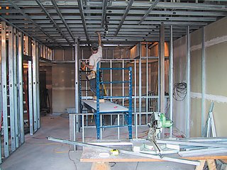 Working within an empty shell, the design had to accommodate plumbing fixtures and existing concrete floors and ceilings.