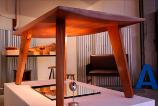 Andrew Riiska's Belly table is gently bowed down below, with detailing on the flat top surface. A seriously sturdy, good-looking piece.
