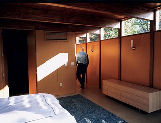 The house’s interior walls are medium-density fiberboard, the sort of material that more typically is covered with drywall. Instead, the fiberboard was coated with a linseed oil to accent its natural, rich tan and finished with a catalyzed var-nish to make it water-resistant. The effect is an interior wall surface that complements the earth tones that dominate the house’s decor and never needs to be painted.