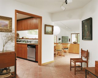 The central spine of the house jogs left to include the kitchen, which eventually leads out to the garage. Cohen tried to keep the garage relatively small, claiming many Americans give their cars the best spot in the house.