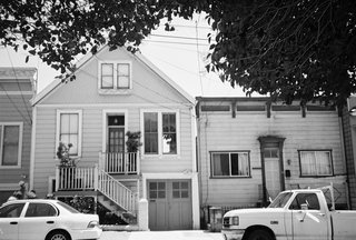 The original home was built in 1901, five years before the 1906 earthquake and fires that destroyed much of the city. Since then, Bernal Heights has created its own planning code which requires new renovation to include two side-by-side, off-street parking spaces since the winding roads of the area make parking problematic. To do so, Willmer had to create a new, wider garage, but when she presented the design to the board for review, the historic technicians said that they wanted Willmer to keep the original garage door in order to maintain the historic fabric of the neighborhood. In the end, Willmer was able to keep the original door and gain permission to forgo adding the second parking space. "The Ellers didn't want to park two cars inside the house," she says. "It took up too much space."<br><br>Photo by Ken Gutmaker