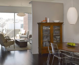 The original house ended at the back wall of the dining room, though it was previously the kitchen. The extended space adds more public areas and the sliding glass doors that lead out to the patio beyond the family room bring in extra daylight.<br><br>Photo by Ken Gutmaker