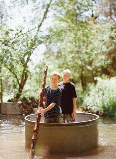 Diamond in the Rough (and Ready) - Photo 3 of 13 - Dylan, 10, and Zoe, 13, have a lazy float down the creek, Huck Finn–style, in a steel horse-watering tank.