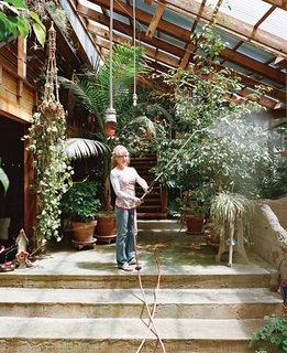Diamond in the Rough (and Ready) - Photo 5 of 13 - Sue waters the indoor foliage with an industrial hose hung from the ceiling.